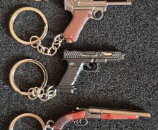 Keyring, firearms, luger. Nagant, glock, colt.