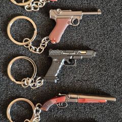 Keyring, firearms, luger. Nagant, glock, colt.