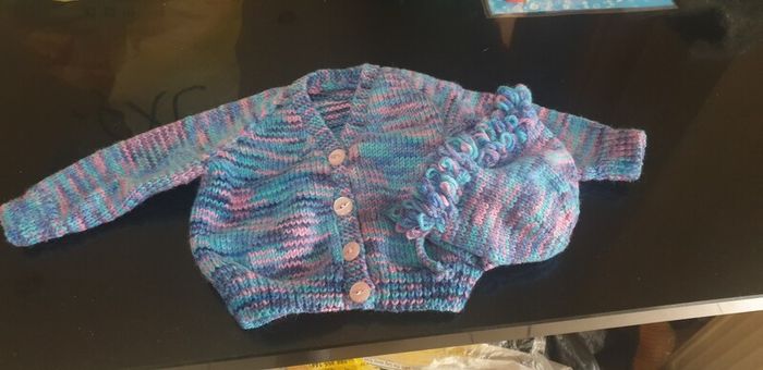 Hand knit baby jacket and bonnet