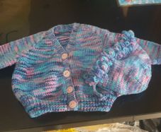 Hand knit baby jacket and bonnet