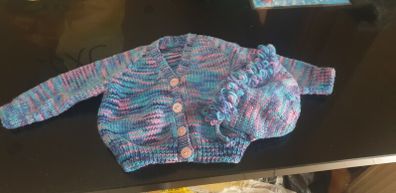 Hand knit baby jacket and bonnet