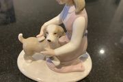 Annie Rowe figure girl brushing dog