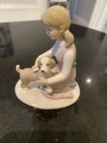 Annie Rowe figure girl brushing dog