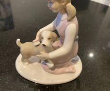 Annie Rowe figure girl brushing dog