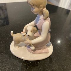 Annie Rowe figure girl brushing dog