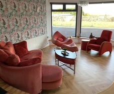 Living room / Sunroom couch and arm chairs red
