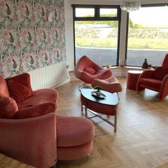 Living room / Sunroom couch and arm chairs red
