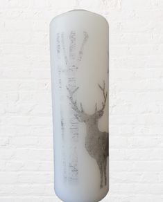 Winter christmas decorative white candle with grey deer reindeer Xmas table home decor Xmas eve gift advent scandinavian style tree wood star