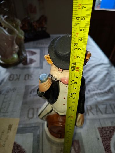 1950s to 70s Working Musical Decanter Hobo Clown Sitting on a Barrel. The base plays the tune Show Me the Way to Go Home, reminded me of the song from Jaws
