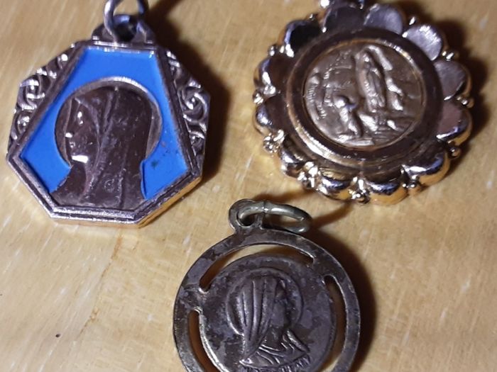 three yellow metal religious medals (m), tub 3