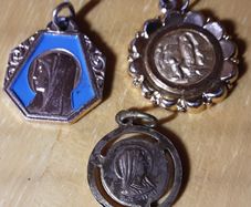 three yellow metal religious medals (m), tub 3