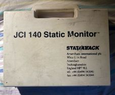This is a JCI 140 Static Monitor kit by Stat Attack (Amersham International plc), designed to measure surface static voltage in industrial, electronic, or laboratory environments.