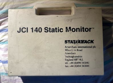 This is a JCI 140 Static Monitor kit by Stat Attack (Amersham International plc), designed to measure surface static voltage in industrial, electronic, or laboratory environments.