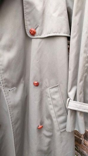 Vintage Nuage ladies trenchcoat Approximately late 90s early 00s Size 10 on label The colour is a pale bluey grey with brown buttons It's got an inner lining that can be removed