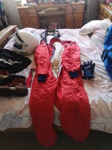 Complete race package helmet, suit, gloves, boots, hans device