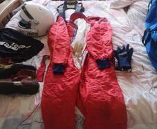Complete race package helmet, suit, gloves, boots, hans device
