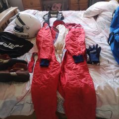 Complete race package helmet, suit, gloves, boots, hans device