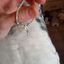 Silver toned bracelet with a heart shaped charm Image 2