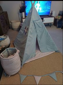 Kids teepee tent with cushions, storage basket and bunting