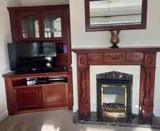 Mahogany cabinets, tv unit, fireplace