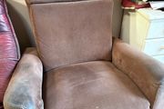 Reclining armchair with footrest