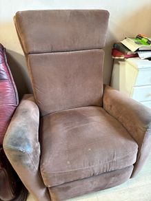 Reclining armchair with footrest