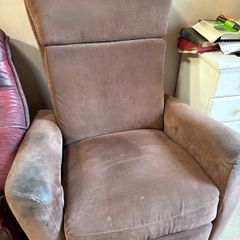 Reclining armchair with footrest