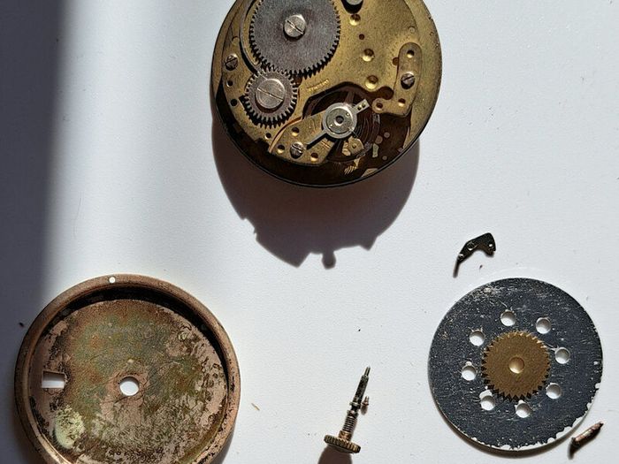 Lot of Antique Watch Parts in Containers