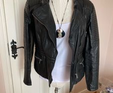 womans black leather jacket