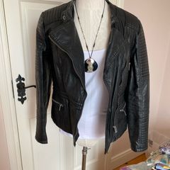 womans black leather jacket