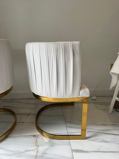 Cream and gold armchairs
