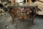 This is an old wrought iron, console table