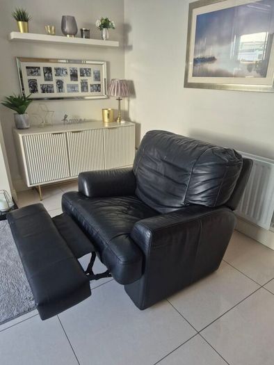 Black leather corner sofa and recliner chair