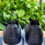 Black sneakers with thick white sole Image 4