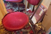 2 red velvet chairs read full ad