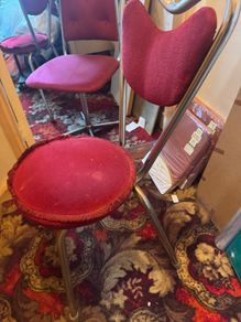 2 red velvet chairs read full ad