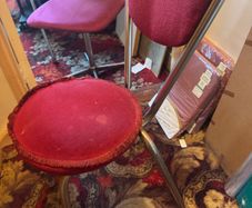 2 red velvet chairs read full ad