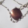 a vintage locket  penden on a long chain with pearls and white stones Image 3