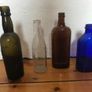 4 assorted Vintage glass bottles. Image 2