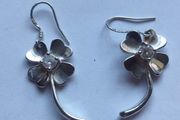 A pair of Sterling Silver earrings.