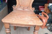 two oak chairs and an old  card table