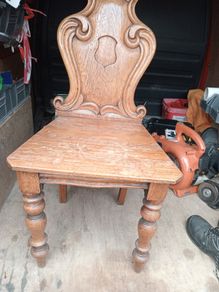 two oak chairs and an old  card table