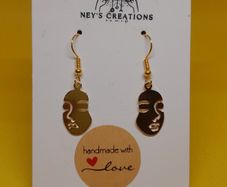 Women face charm earrings
