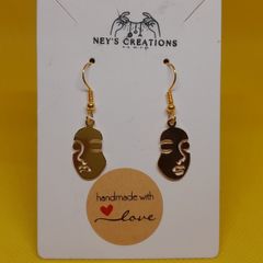 Women face charm earrings