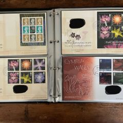 Collection of  87 UK First Day Cover stamps 2003 to 2006 in album