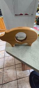 wooden piggy bank featuring a clear viewing window so you can see your savings grow.