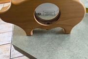 wooden piggy bank featuring a clear viewing window so you can see your savings grow.