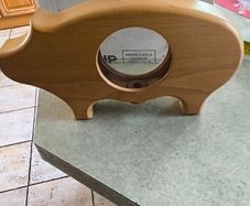 wooden piggy bank featuring a clear viewing window so you can see your savings grow.
