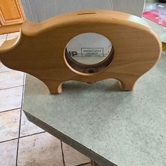 wooden piggy bank featuring a clear viewing window so you can see your savings grow.