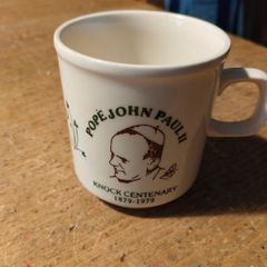 vintage commemorative mug honors the 1979 visit of Pope John Paul II to Knock, Ireland.